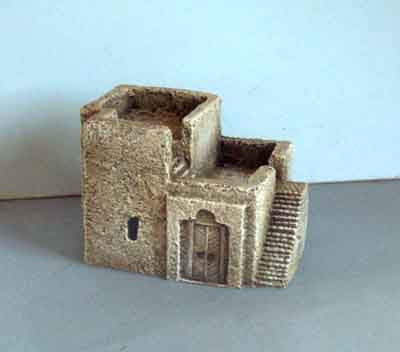 Square two storey house outside stairs to first and second floor. (H32)